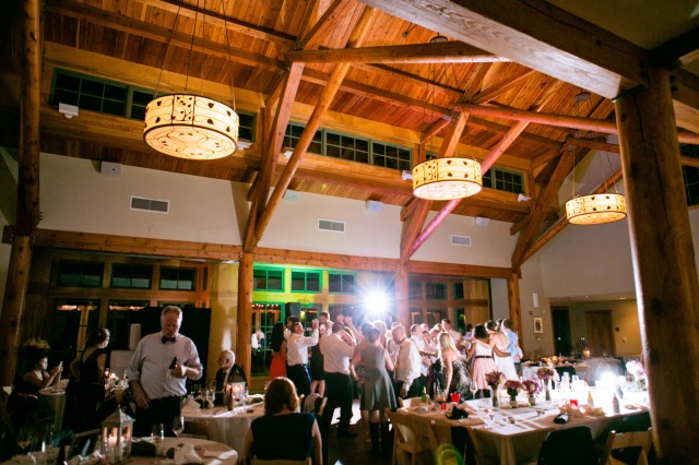 Inside the Dorris Duke Center at Duke Gardens in Durham North Carolina.  Guests dance on the dance floor after a good meal